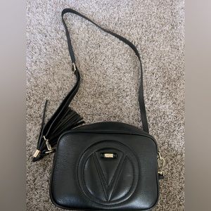 Black Valentino cross body bag.